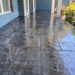 Our Work: A stunning stamped concrete patio in a captivating blue hue.