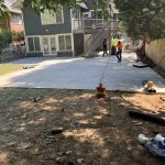 Our Work includes building a concrete patio in a backyard.