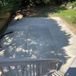 Our Work: An aerial view of a backyard with a concrete patio showcases our expertise.