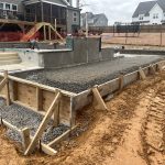 Our Work involves the construction of a house with a concrete foundation.