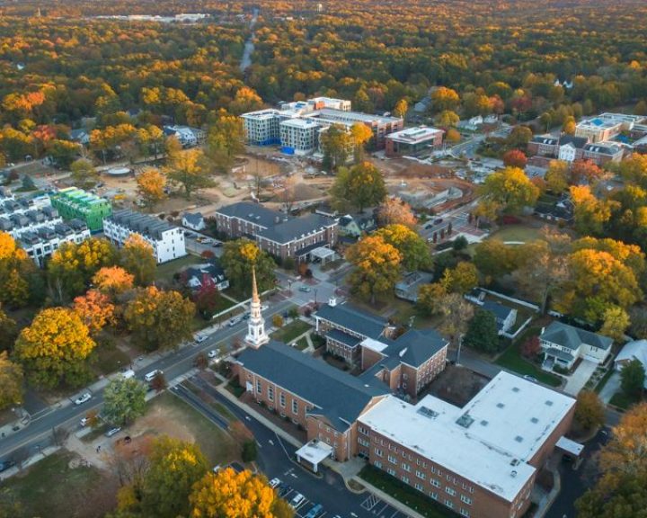 An aerial view of a campus in the fall, showcasing its service areas.