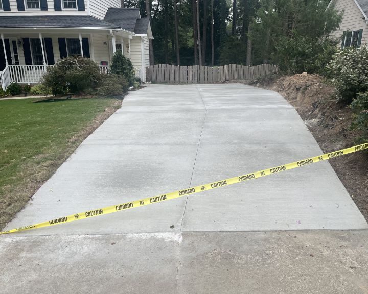 A city driveway with a yellow tape on it.